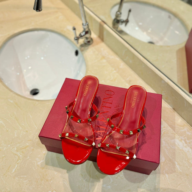ROCKSTUD MULE SANDALS IN CHERRY RED CALFSKIN AND TRANSPARENT PVC FILM