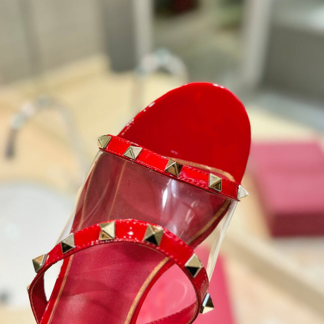 ROCKSTUD MULE SANDALS IN CHERRY RED CALFSKIN AND TRANSPARENT PVC FILM
