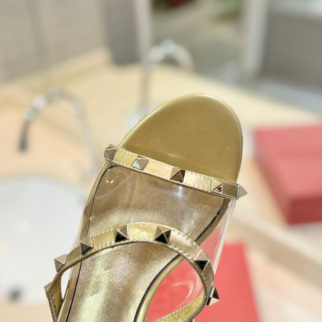 ROCKSTUD MULE SANDALS IN GOLD CALFSKIN AND TRANSPARENT PVC FILM