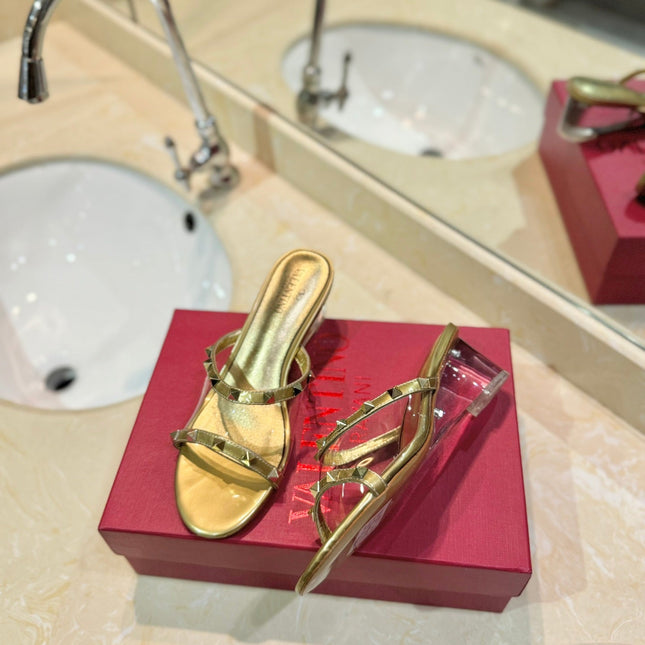 ROCKSTUD MULE SANDALS IN GOLD CALFSKIN AND TRANSPARENT PVC FILM
