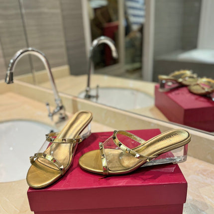 ROCKSTUD MULE SANDALS IN GOLD CALFSKIN AND TRANSPARENT PVC FILM