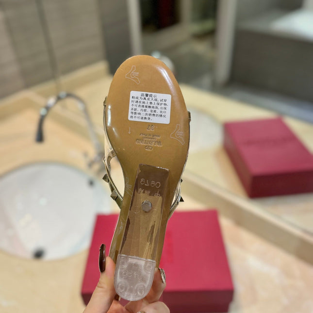 ROCKSTUD MULE SANDALS IN GOLD CALFSKIN AND TRANSPARENT PVC FILM