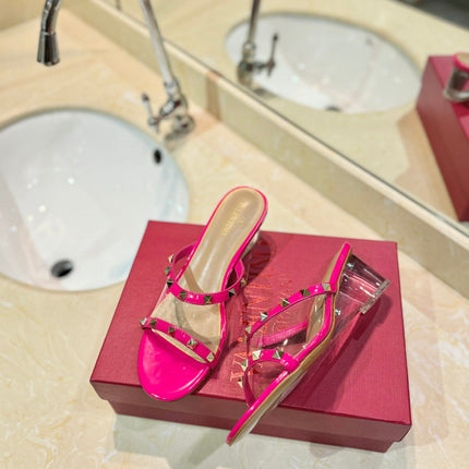 ROCKSTUD MULE SANDALS IN BRIGHT PINK CALFSKIN AND TRANSPARENT PVC FILM