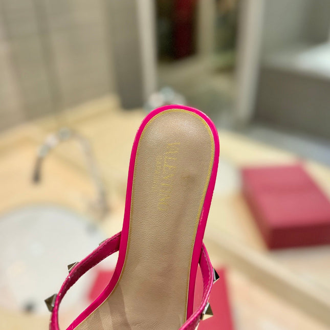 ROCKSTUD MULE SANDALS IN BRIGHT PINK CALFSKIN AND TRANSPARENT PVC FILM