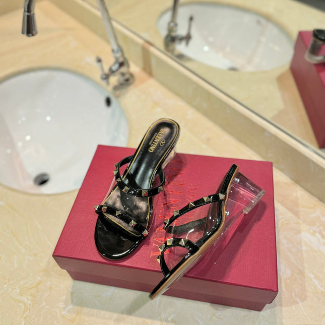 ROCKSTUD MULE SANDALS IN BLACK CALFSKIN AND TRANSPARENT PVC FILM