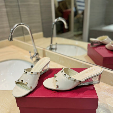 ROCKSTUD MULE SANDALS WITH TRANSPARENT HEEL IN WHITE CALFSKIN