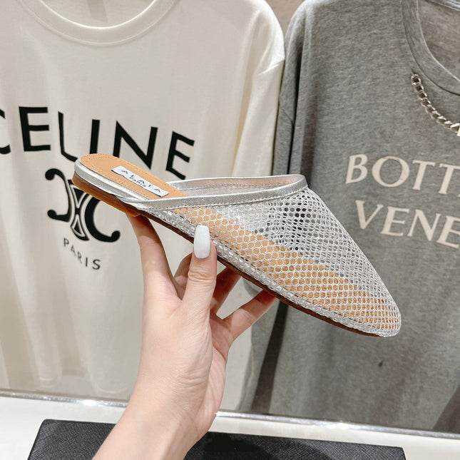 ALAIA FLAT MULES IN SILVER MESH FISHNET
