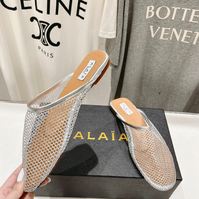 ALAIA FLAT MULES IN SILVER MESH FISHNET