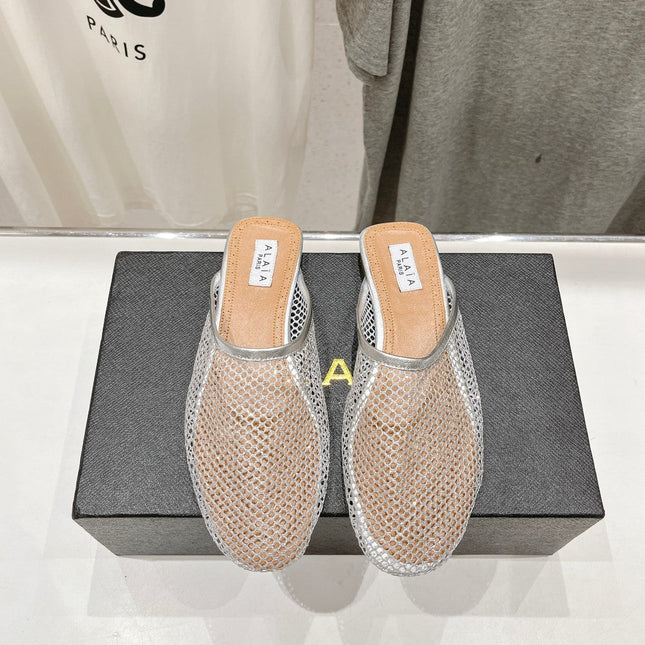 ALAIA FLAT MULES IN SILVER MESH FISHNET