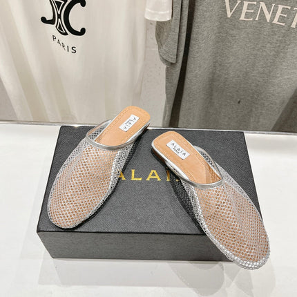 ALAIA FLAT MULES IN SILVER MESH FISHNET