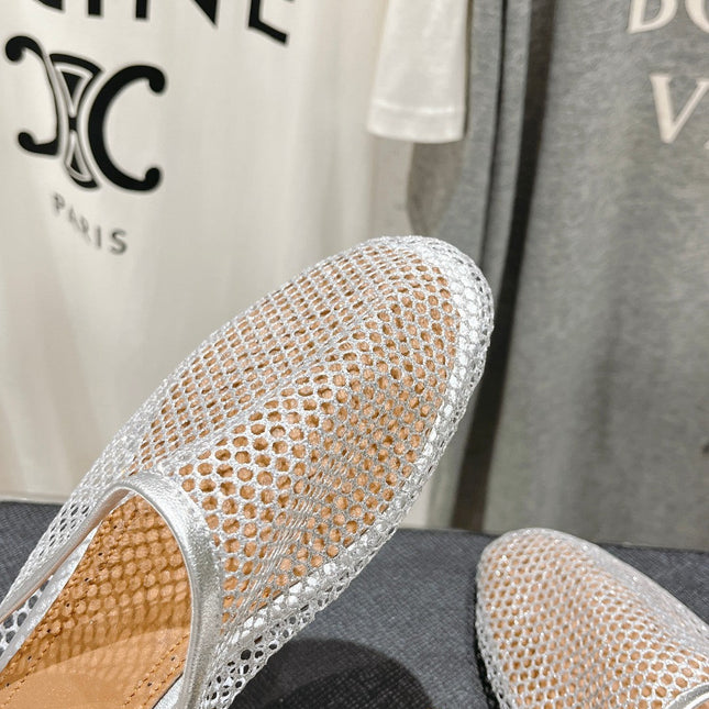ALAIA FLAT MULES IN SILVER MESH FISHNET