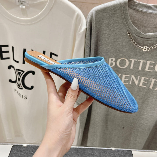 ALAIA FLAT MULES IN CERULEAN BLUE MESH FISHNET