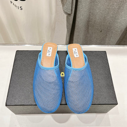 ALAIA FLAT MULES IN CERULEAN BLUE MESH FISHNET