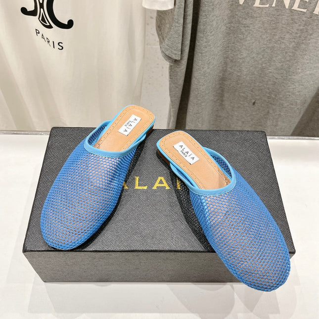 ALAIA FLAT MULES IN CERULEAN BLUE MESH FISHNET
