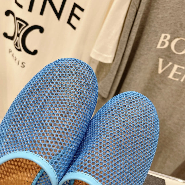 ALAIA FLAT MULES IN CERULEAN BLUE MESH FISHNET