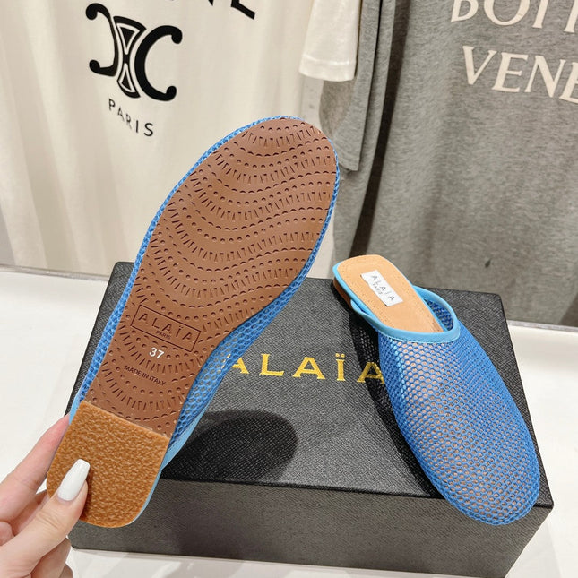 ALAIA FLAT MULES IN CERULEAN BLUE MESH FISHNET