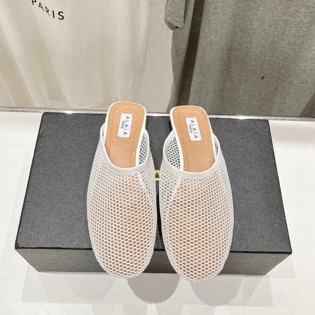 ALAIA FLAT MULES IN WHITE MESH FISHNET