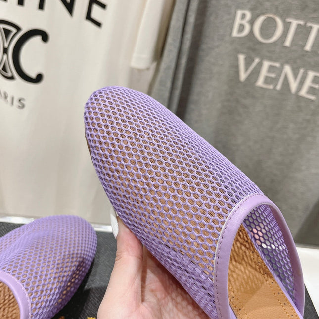 ALAIA FLAT MULES IN LIGHT PURPLE MESH FISHNET